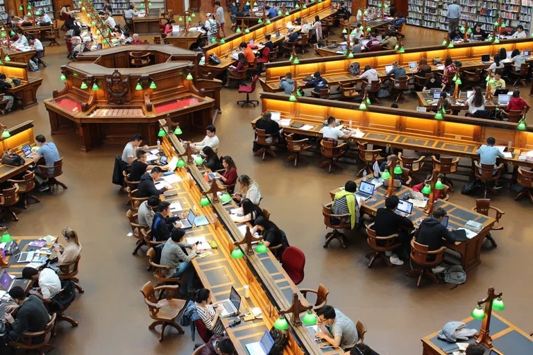 Birdseye view of a college university library filled with students
